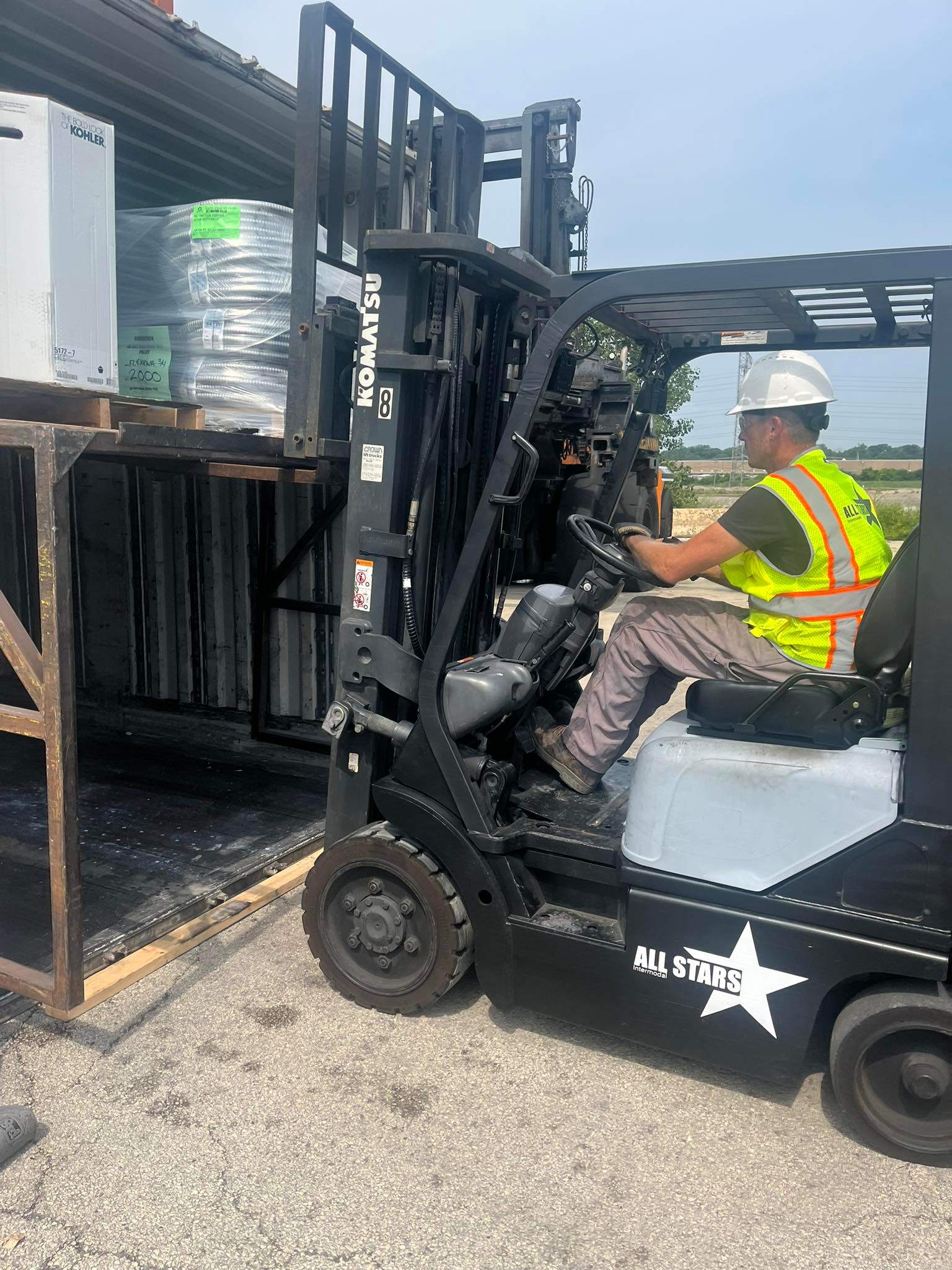 All Stars Intermodal operator on forklift loading container